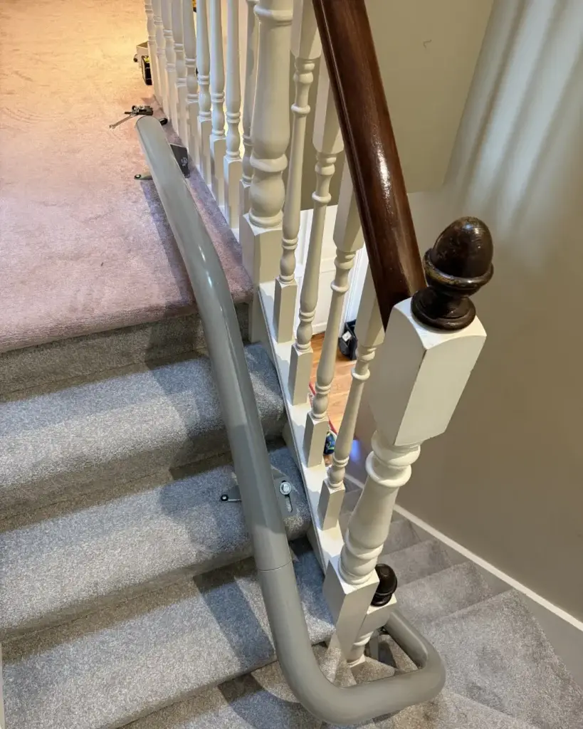 Rail turning around Mary’s upper landing