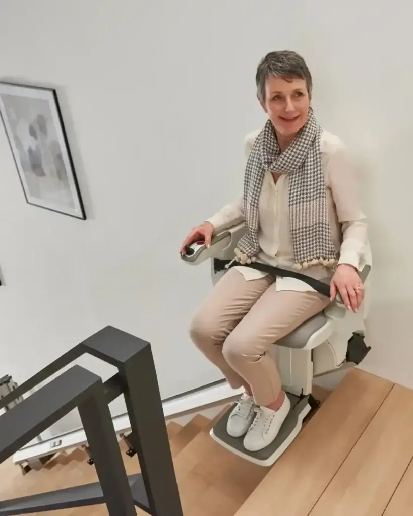 HomeGlide seated user at an upper landing